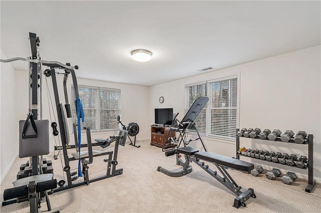 exercise room with carpet floors