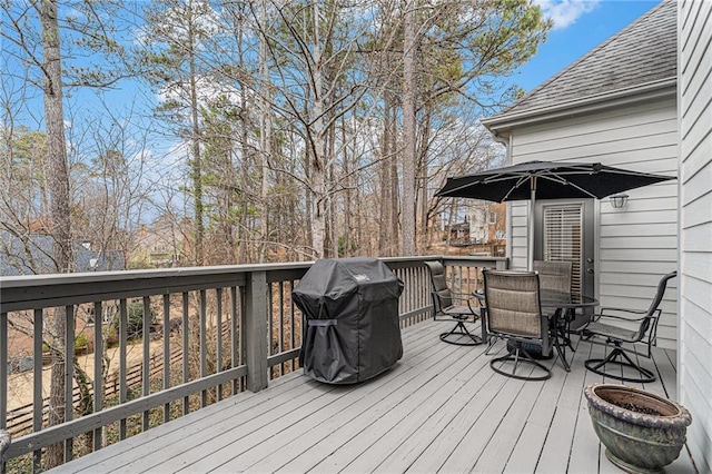 wooden terrace with area for grilling