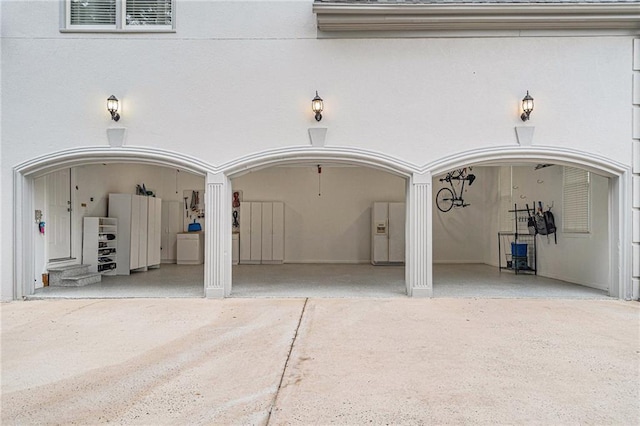 exterior space featuring white fridge with ice dispenser