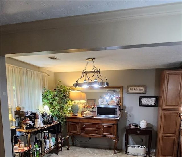 dining space featuring light tile patterned floors