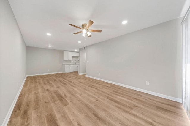 interior space featuring ceiling fan and light wood-type flooring