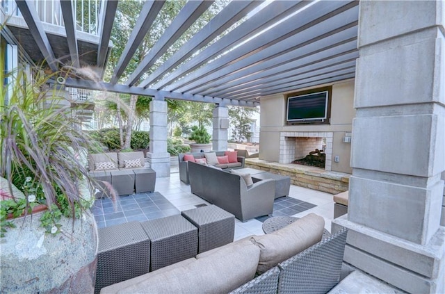 view of patio / terrace featuring a pergola and an outdoor living space with a fireplace