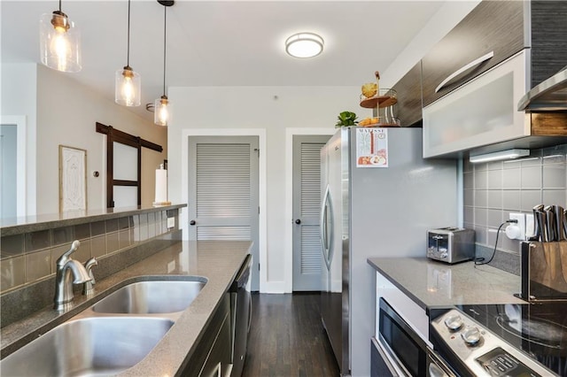 1300 Dekalb Ave NE Unit 731, Atlanta, GA 30307 - kitchen with a sink, a barn door, backsplash, and dark wood finished floors