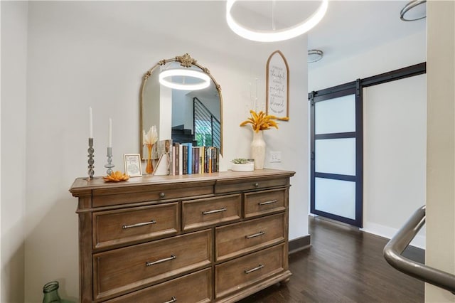 1300 Dekalb Ave NE Unit 731, Atlanta, GA 30307 - detailed view of wood finished floors, a barn door, and baseboards