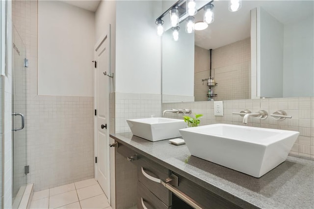 1300 Dekalb Ave NE Unit 731, Atlanta, GA 30307 - bathroom featuring tile walls, a shower stall, tile patterned flooring, and double vanity