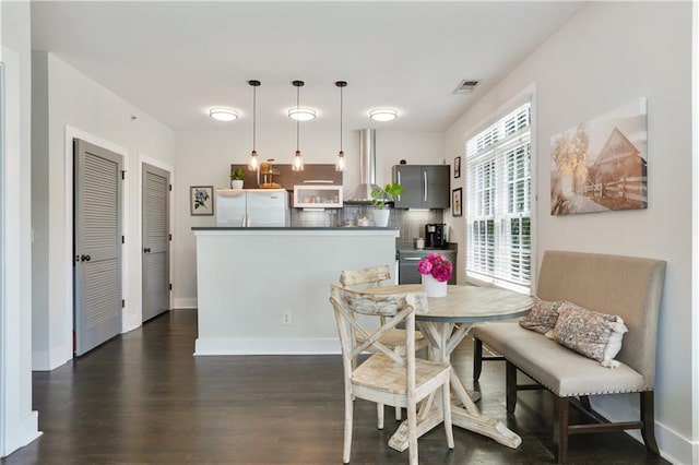 1300 Dekalb Ave NE Unit 731, Atlanta, GA 30307 - dining room with dark wood-style floors and baseboards