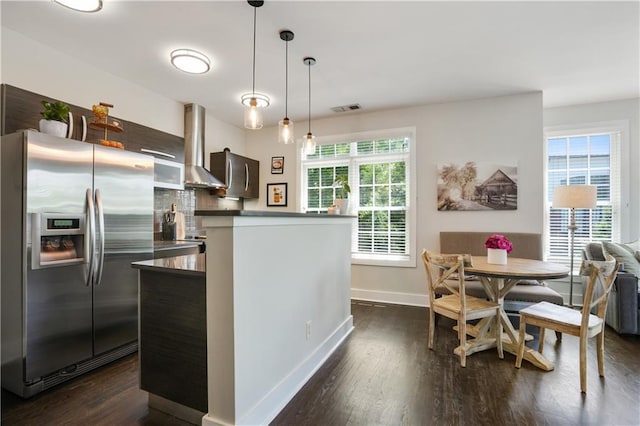1300 Dekalb Ave NE Unit 731, Atlanta, GA 30307 - kitchen featuring stainless steel refrigerator with ice dispenser, baseboards, dark wood-type flooring, and wall chimney exhaust hood