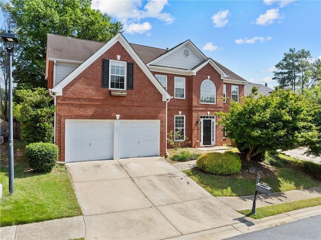 view of front of property with a front yard and a garage