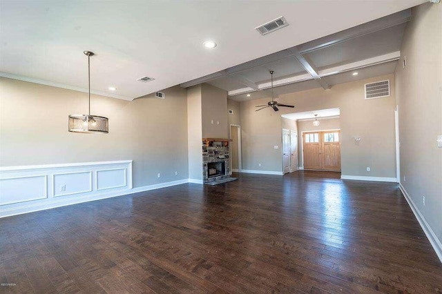 unfurnished living room featuring dark wood-style floors, a fireplace, visible vents, and coffered ceiling