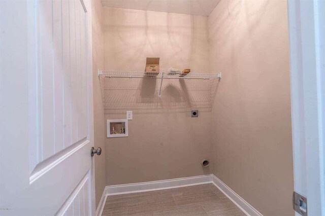 washroom with washer hookup, laundry area, electric dryer hookup, and baseboards