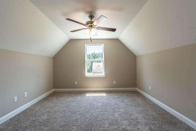 bonus room with carpet floors, baseboards, a ceiling fan, and lofted ceiling