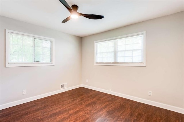 1401 Pine Ave, East Point, GA 30344 - spare room with healthy amount of natural light, ceiling fan, and dark wood-style floors