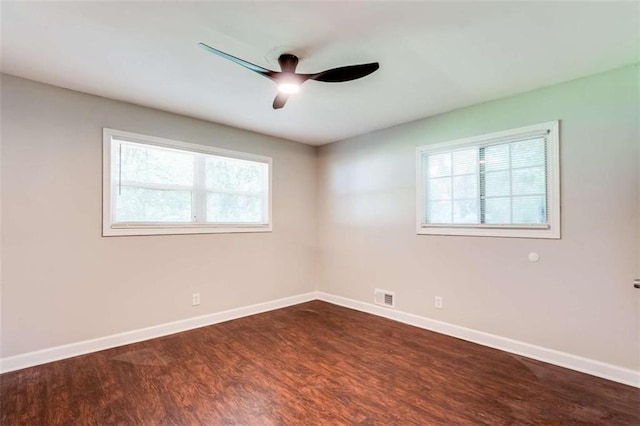 1401 Pine Ave, East Point, GA 30344 - unfurnished room with healthy amount of natural light, dark wood-style floors, and a ceiling fan