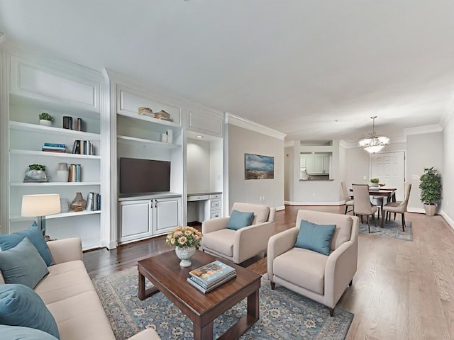 3334 Peachtree Rd NE Unit 614, Atlanta, GA 30326 - living room featuring crown molding, a chandelier, and wood finished floors