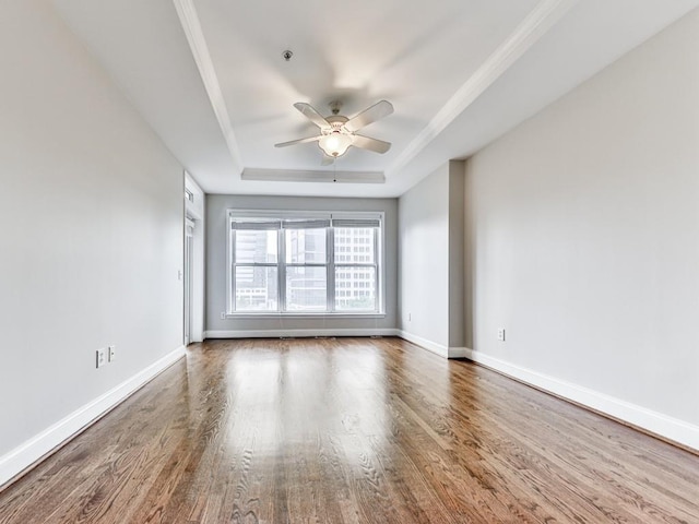 3334 Peachtree Rd NE Unit 614, Atlanta, GA 30326 - unfurnished room with a raised ceiling, wood finished floors, and ceiling fan