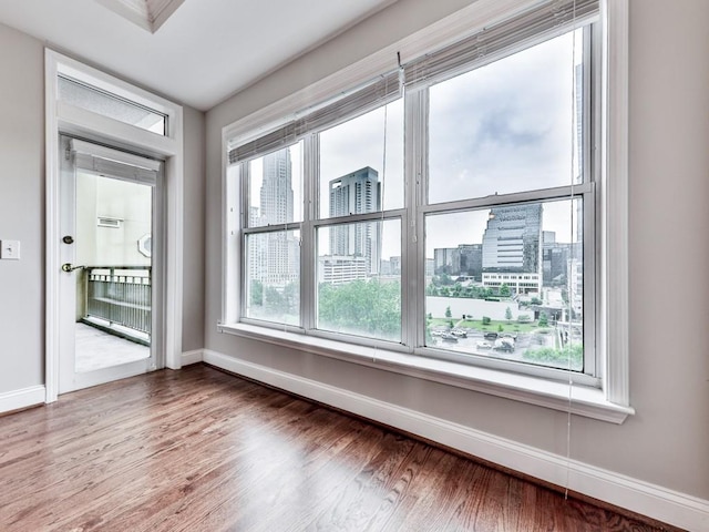 3334 Peachtree Rd NE Unit 614, Atlanta, GA 30326 - spare room featuring wood finished floors and a view of city