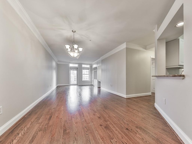 3334 Peachtree Rd NE Unit 614, Atlanta, GA 30326 - empty room featuring crown molding, a chandelier, and wood finished floors