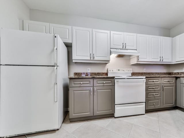3334 Peachtree Rd NE Unit 614, Atlanta, GA 30326 - kitchen featuring white appliances, under cabinet range hood, light tile patterned floors, white cabinetry, and gray cabinetry