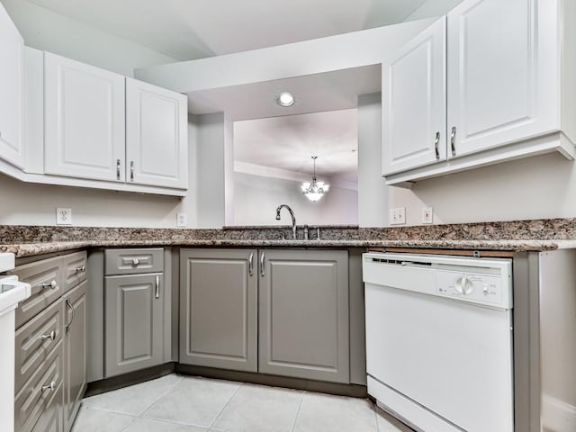 3334 Peachtree Rd NE Unit 614, Atlanta, GA 30326 - kitchen with dishwasher, light tile patterned floors, white cabinetry, recessed lighting, and a chandelier