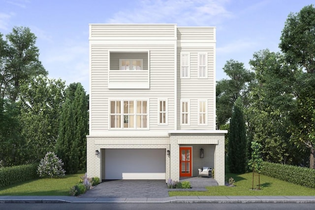 modern home featuring a garage and a front lawn