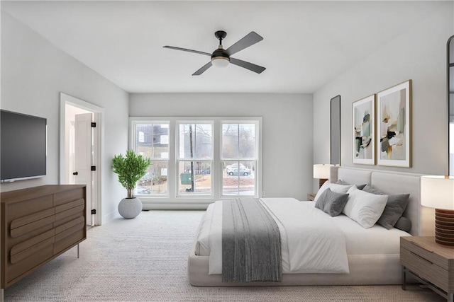 bedroom featuring ceiling fan and light colored carpet