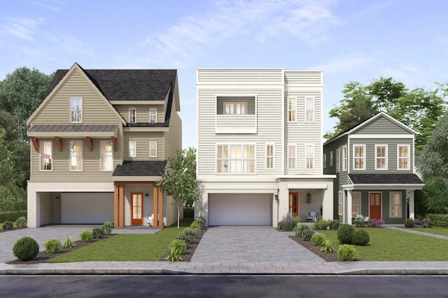 view of front of property featuring a front lawn and a garage