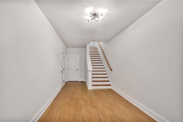 stairs with wood-type flooring