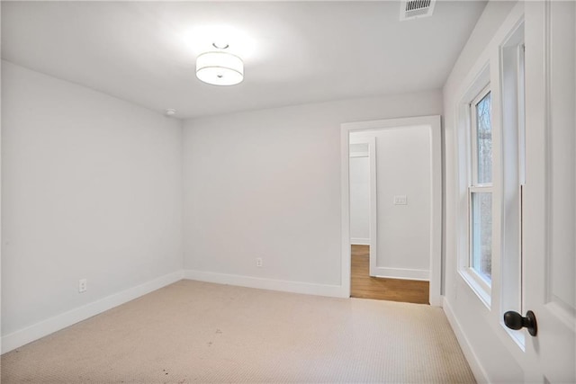 spare room with carpet floors