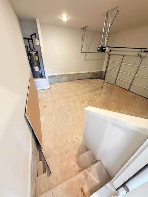 5518 Legacy Trl, Douglasville, GA 30135 - garage with electric water heater and a garage door opener
