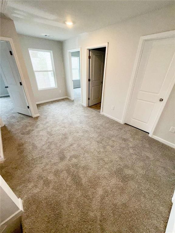 5518 Legacy Trl, Douglasville, GA 30135 - unfurnished bedroom with baseboards and carpet