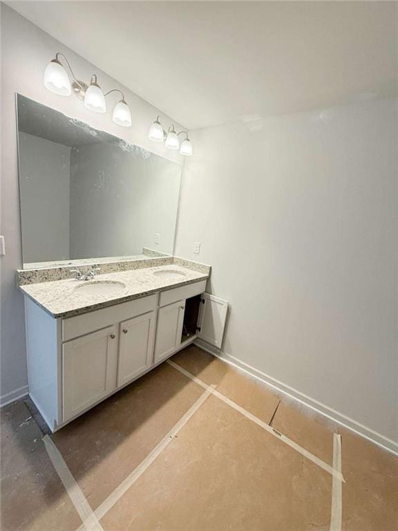 5518 Legacy Trl, Douglasville, GA 30135 - bathroom featuring double vanity and baseboards