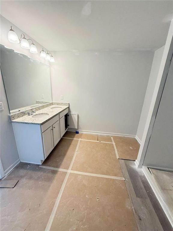 5518 Legacy Trl, Douglasville, GA 30135 - bathroom featuring double vanity, baseboards, and a stall shower