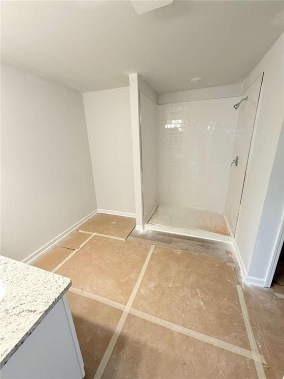 5518 Legacy Trl, Douglasville, GA 30135 - bathroom with a shower stall, vanity, and baseboards