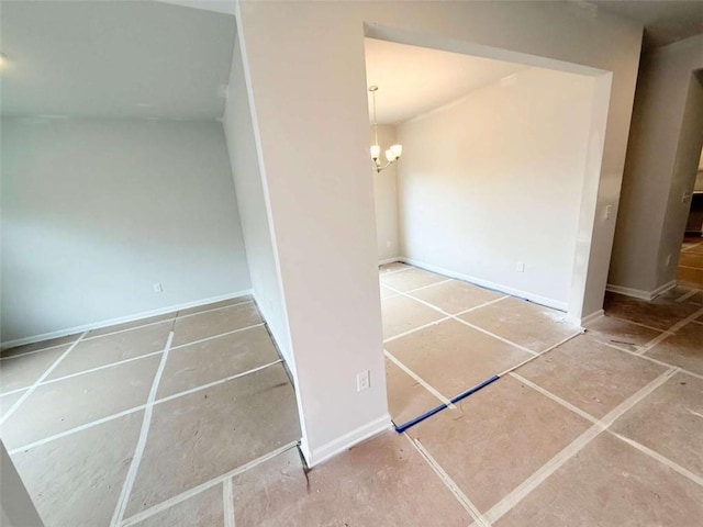 5518 Legacy Trl, Douglasville, GA 30135 - spare room featuring a chandelier and baseboards