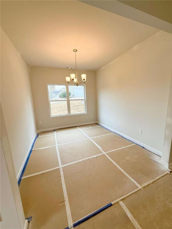5518 Legacy Trl, Douglasville, GA 30135 - spare room featuring a chandelier and baseboards