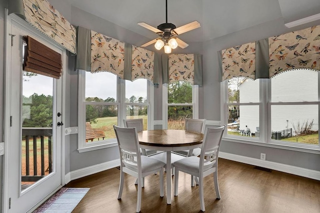 sunroom / solarium featuring ceiling fan and a healthy amount of sunlight