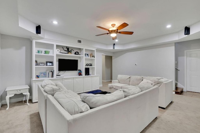 living room with light carpet and ceiling fan