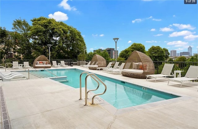 view of swimming pool featuring a patio area