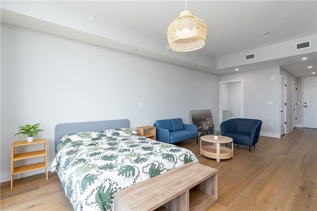 bedroom with wood-type flooring