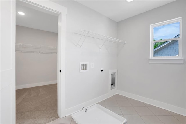 clothes washing area with hookup for an electric dryer, laundry area, baseboards, and washer hookup