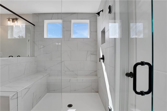 full bath featuring a shower stall