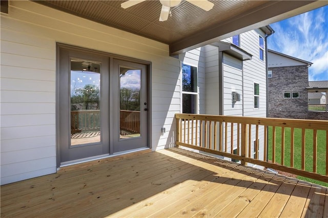 wooden terrace featuring french doors and a ceiling fan