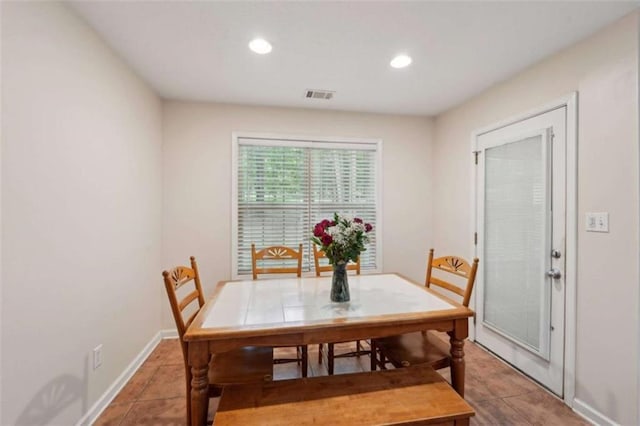 dining area with light tile patterned floors, recessed lighting, and baseboards