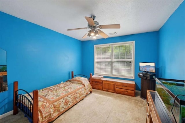 bedroom featuring carpet, a ceiling fan, and baseboards