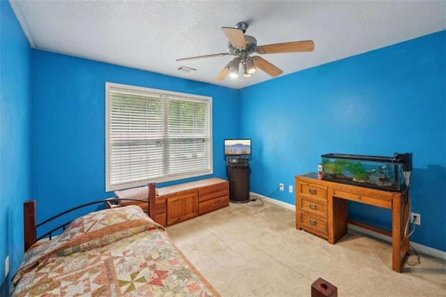 bedroom with baseboards, carpet floors, and a ceiling fan