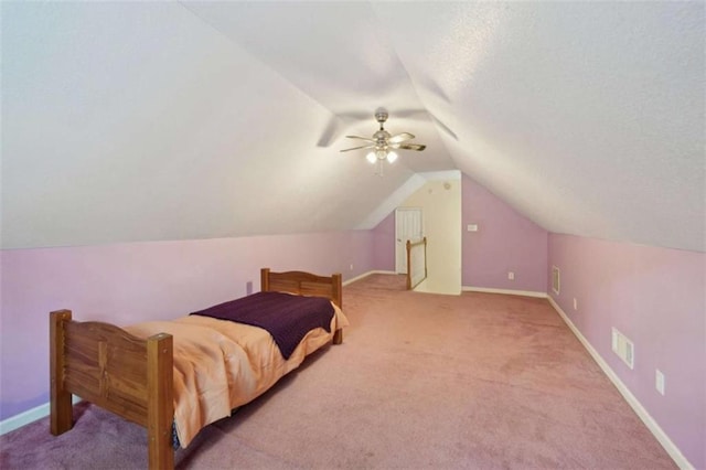 bedroom featuring vaulted ceiling, ceiling fan, carpet, and baseboards