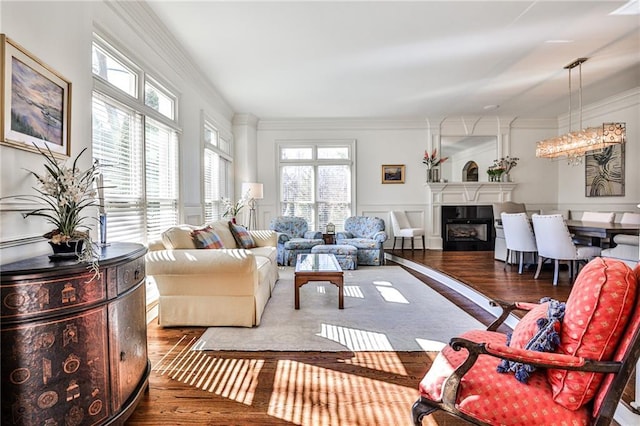 620 Elizabeth Oak Ct, Alpharetta, GA 30004 - living area with wood finished floors, a fireplace, and crown molding