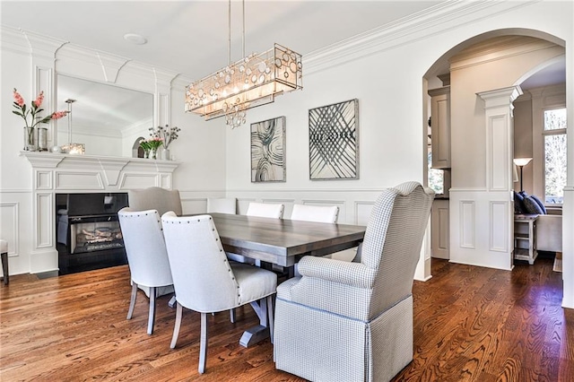 620 Elizabeth Oak Ct, Alpharetta, GA 30004 - dining room with a decorative wall, crown molding, arched walkways, wood finished floors, and wainscoting
