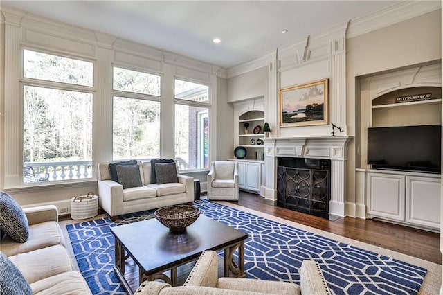 620 Elizabeth Oak Ct, Alpharetta, GA 30004 - living room with crown molding, plenty of natural light, built in features, dark wood finished floors, and a fireplace