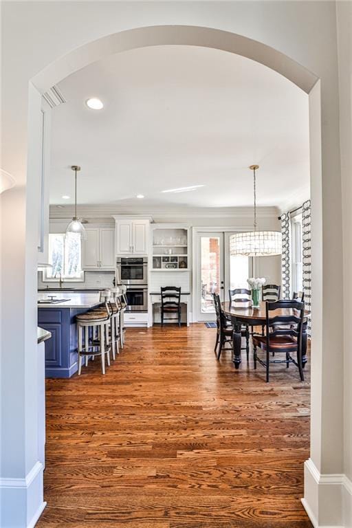 620 Elizabeth Oak Ct, Alpharetta, GA 30004 - dining space with arched walkways, plenty of natural light, dark wood-style flooring, and recessed lighting